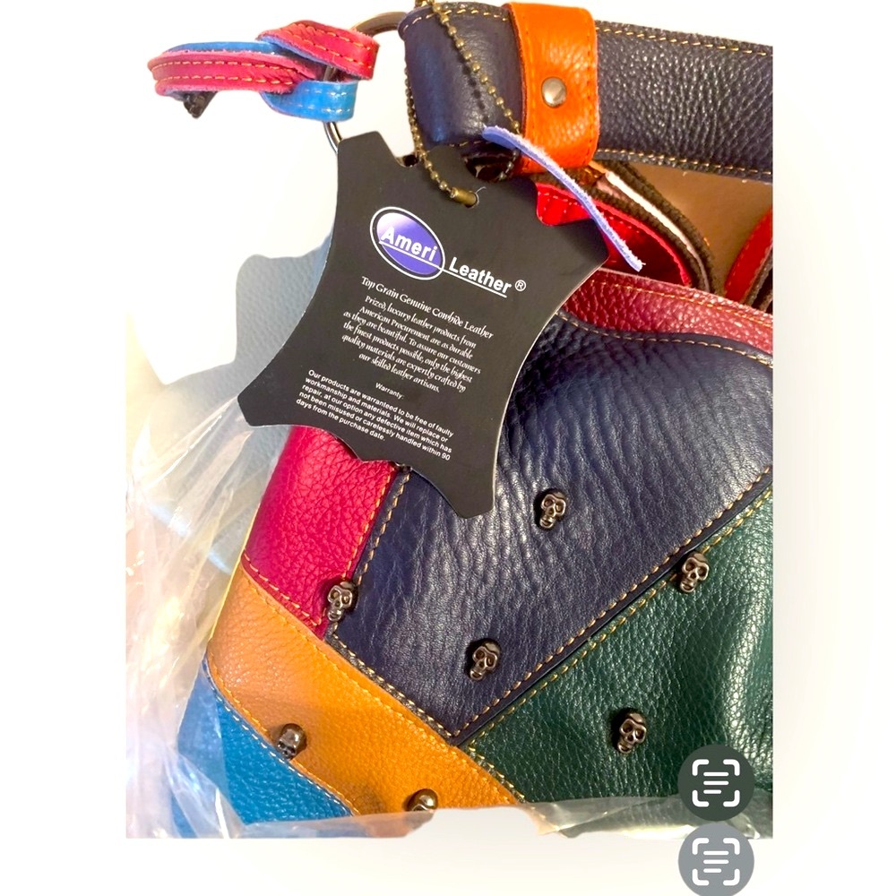 AmeriLeather Crossbody bag with tiny skull head adornments. - Picture 2 of 5